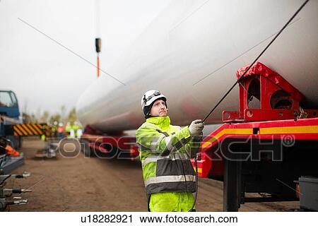 Engineer working on wind turbine View Large Photo Image Stock Image - Engineer working on wind turbine. Fotosearch