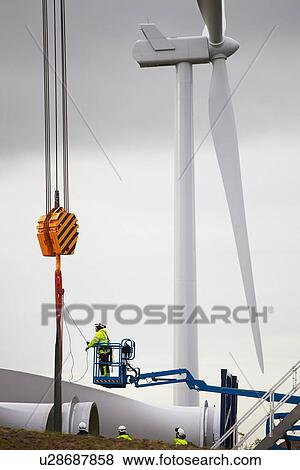 Engineer working on wind turbine View Large Photo Image Stock Photo - Engineer working on wind turbine. Fotosearch