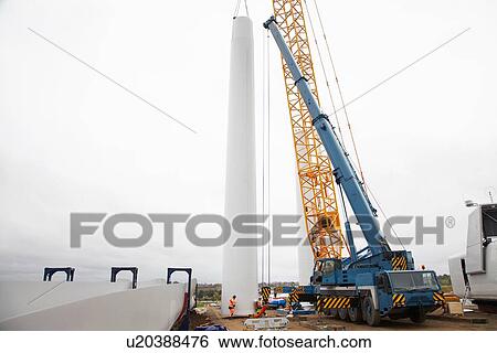 Stock Photograph - Engineers working at wind farm. Fotosearch