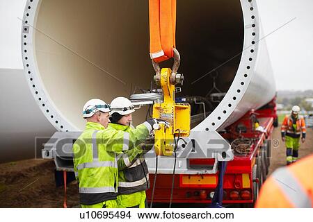 Picture - Engineers working on wind turbine. Fotosearch