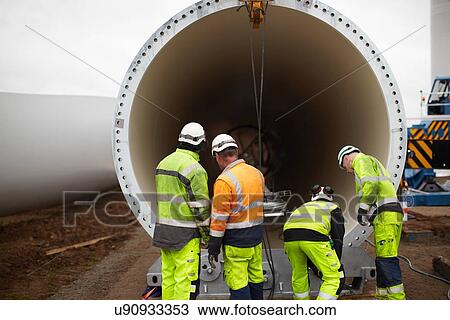 Engineers working on wind turbine View Large Photo Image Stock Image - Engineers working on wind turbine. Fotosearch