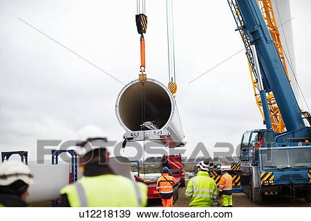 Engineers working on wind turbine View Large Photo Image Stock Photo - Engineers working on wind turbine. Fotosearch