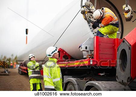 Engineers working on wind turbine View Large Photo Image Stock Photograph - Engineers working on wind turbine. Fotosearch
