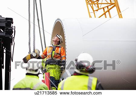 Engineers working on wind turbine View Large Photo Image Stock Photography - Engineers working on wind turbine. Fotosearch