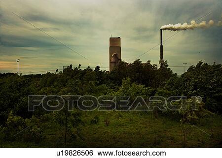 Stock Photograph - Factory chimney with smoke. Fotosearch