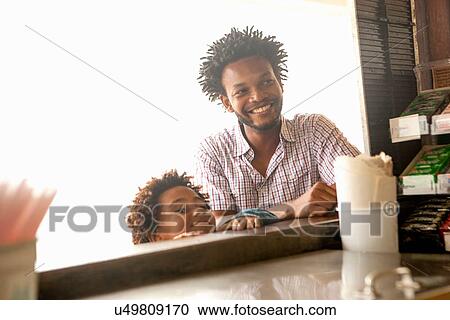 "Father and son at beach bar, Ipanema beach, Rio De Janeiro, Brazil" View Large Photo Image Stock Image - "Father and son at beach bar, Ipanema beach, Rio De Janeiro, Brazil". Fotosearch
