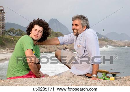 Stock Image - "Father and son, Ipanema Beach, Rio de Janeiro, Brazil". Fotosearch