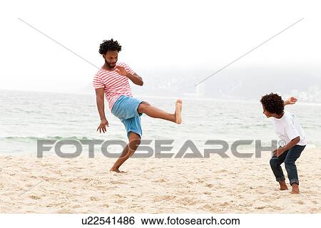 "Father and son playing on beach, RIo de Janeiro, Brazil" View Large Photo Image Stock Photograph - "Father and son playing on beach, RIo de Janeiro, Brazil". Fotosearch