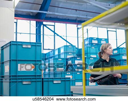 Female worker on production line in factory View Large Photo Image Picture - Female worker on production line in factory. Fotosearch