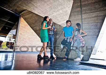 Stock Photo - Four students at college. Fotosearch