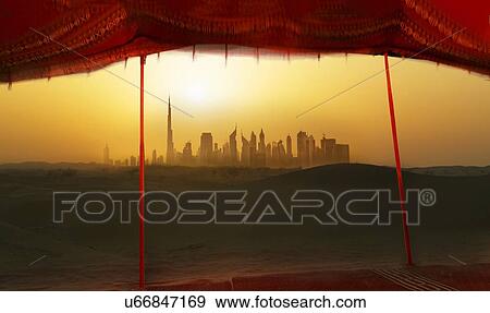 Stock Photo - "Futuristic cityscape from bedouin tent, Dubai, United Arab Emirates". Fotosearch