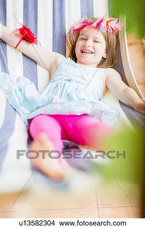 Girl lying in hammock View Large Photo Image Picture - Girl lying in hammock. Fotosearch