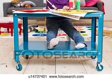 Girl painting on paper at home View Large Photo Image Stock Image - Girl painting on paper at home. Fotosearch