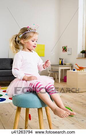 Picture - Girl playing fairy princess. Fotosearch