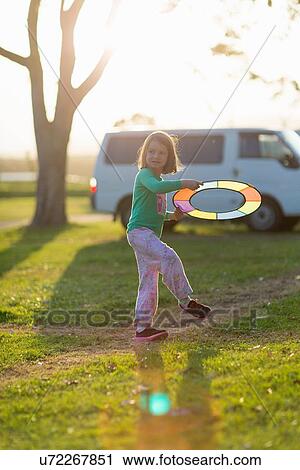 Girl playing frisbee View Large Photo Image Stock Image - Girl playing frisbee. Fotosearch