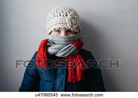 Girl warmly wrapped up in woollen hat and scarf View Large Photo Image Stock Photography - Girl warmly wrapped up in woollen hat and scarf. Fotosearch