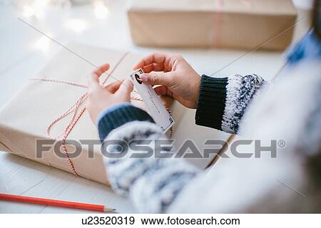 Girl wrapping Christmas gifts View Large Photo Image Stock Photo - Girl wrapping Christmas gifts. Fotosearch