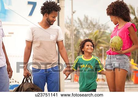 "Grandfather and family strolling at Ipanema Beach, Rio De Janeiro, Brazil" View Large Photo Image Stock Image - "Grandfather and family strolling at Ipanema Beach, Rio De Janeiro, Brazil". Fotosearch
