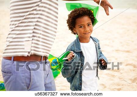 "Grandfather and grandson on beach, RIo de Janeiro, Brazil" View Large Photo Image Stock Photo - "Grandfather and grandson on beach, RIo de Janeiro, Brazil". Fotosearch