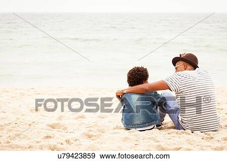 Grandfather and grandson on beach View Large Photo Image Stock Photo - Grandfather and grandson on beach. Fotosearch