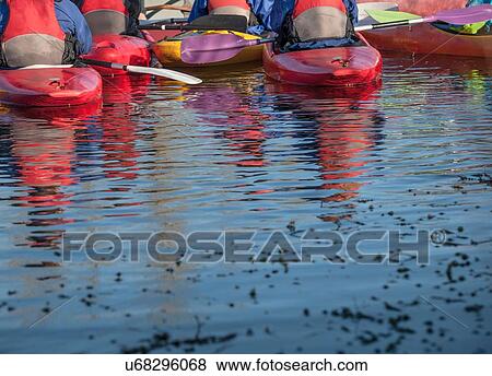 "Group of people in kayaks, rear view" View Large Photo Image Stock Photo - "Group of people in kayaks, rear view". Fotosearch