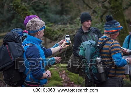 Group of people preparing to go orienteering View Large Photo Image Stock Image - Group of people preparing to go orienteering. Fotosearch