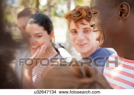 Group of students laughing outdoors View Large Photo Image Picture - Group of students laughing outdoors. Fotosearch