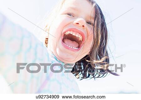 Happy and contented girl View Large Photo Image Stock Photo - Happy and contented girl. Fotosearch