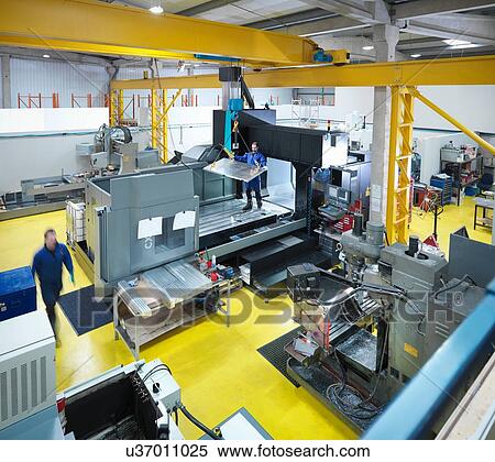 Stock Photography - High angle overview of engineering facility in plastics factory. Fotosearch