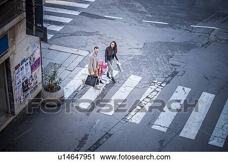 High angle view of couple and daughter on pelican crossing View Large Photo Image Stock Image - High angle view of couple and daughter on pelican crossing. Fotosearch