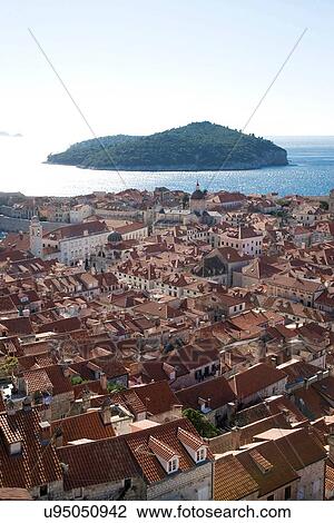 "High angle view of rooftops and distant island, Dubrovnik, Croatia" View Large Photo Image Stock Image - "High angle view of rooftops and distant island, Dubrovnik, Croatia". Fotosearch
