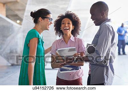 Higher education students laughing View Large Photo Image Stock Photograph - Higher education students laughing. Fotosearch