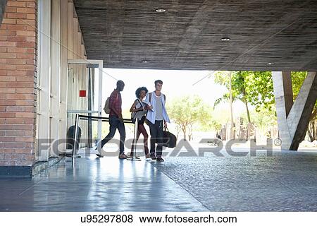 Higher education students leaving college building View Large Photo Image Stock Photo - Higher education students leaving college building. Fotosearch