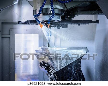 Stock Photo -  Inside CNC cutting machine in engineering factory. Fotosearch