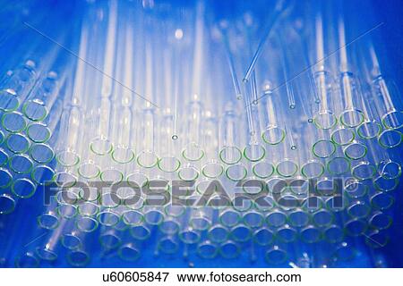 Stock Photo - Low angle view of large group of glass test tubes. Fotosearch