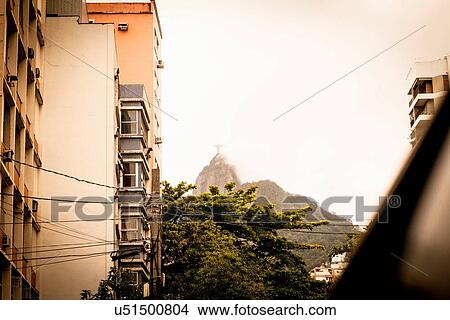 Picture - "Low angle view of misty Christ the Redeemer, Rio De Janeiro, Brazil". Fotosearch