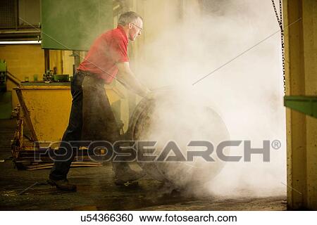 Male cooper rolling whisky cask in cooperage View Large Photo Image Stock Image - Male cooper rolling whisky cask in cooperage. Fotosearch