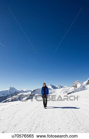 "Male hiker hiking in snow covered landscape, Jungfrauchjoch, Grindelwald, Switzerland" View Large Photo Image Stock Photography - "Male hiker hiking in snow covered landscape, Jungfrauchjoch, Grindelwald, Switzerland". Fotosearch