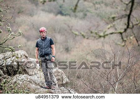 "Male rock climber standing on rocks, portrait" View Large Photo Image Stock Photo - "Male rock climber standing on rocks, portrait". Fotosearch