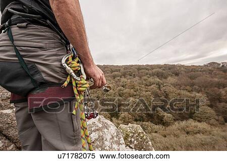 Male rock climber with carabiner and climbing rope View Large Photo Image Stock Photography - Male rock climber with carabiner and climbing rope. Fotosearch