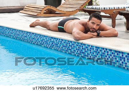 Stock Photography - Man by poolside. Fotosearch