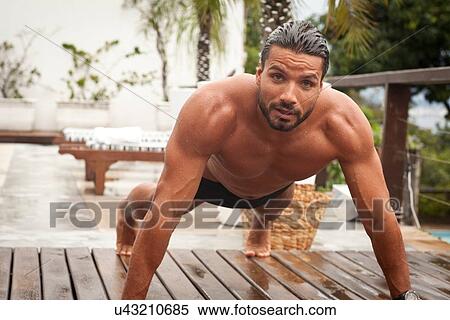 Man doing push ups by poolside View Large Photo Image Stock Photography - Man doing push ups by poolside. Fotosearch