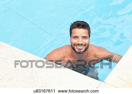 Stock Image - Man in pool. Fotosearch