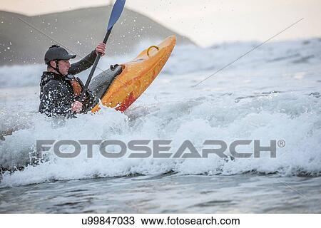 Man sea kayaking View Large Photo Image Stock Image - Man sea kayaking. Fotosearch