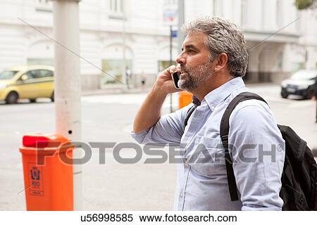 "Man talking on cellphone in street, Rio de Janeiro, Brazil" View Large Photo Image Stock Photography - "Man talking on cellphone in street, Rio de Janeiro, Brazil". Fotosearch
