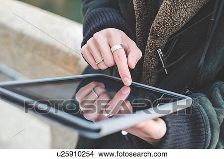 Man using digital tablet View Large Photo Image Picture - Man using digital tablet. Fotosearch