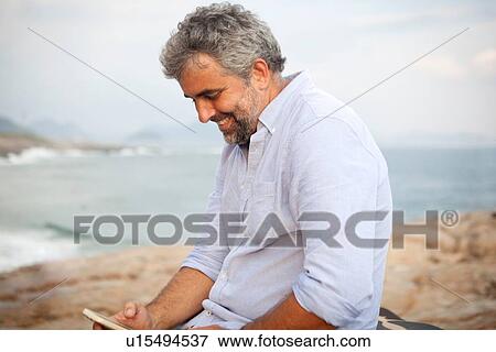"Man using smartphone, Ipanema Beach, Rio de Janeiro, Brazil" View Large Photo Image Stock Photo - "Man using smartphone, Ipanema Beach, Rio de Janeiro, Brazil". Fotosearch