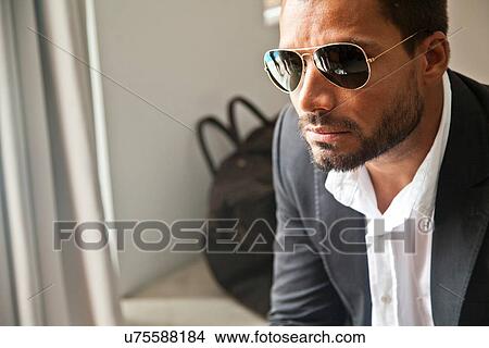 Man waiting indoors View Large Photo Image Picture - Man waiting indoors. Fotosearch