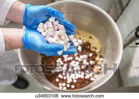 "Marshmallows being poured into cake mix in cake factory, close up" View Large Photo Image Stock Photograph - "Marshmallows being poured into cake mix in cake factory, close up". Fotosearch