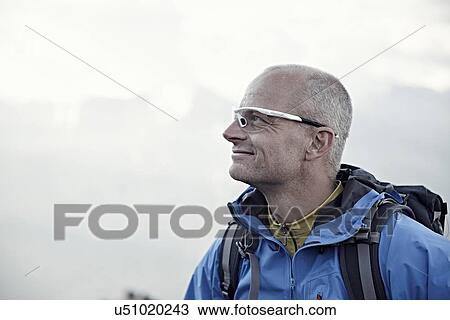 "Mature man wearing sunglasses, portrait" View Large Photo Image Stock Image - "Mature man wearing sunglasses, portrait". Fotosearch